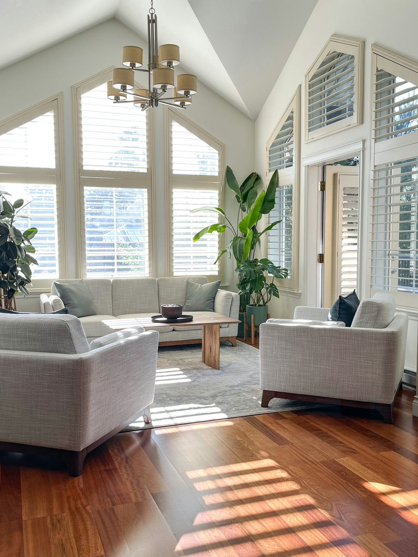 Bright Singapore living room with large windows open for fresh air